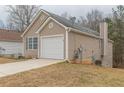 Charming home featuring a one-car garage and a well-maintained lawn at 1080 Abington Ct, Douglasville, GA 30134