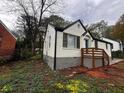 Beautiful home with a white brick exterior, contrasting black trim, and a well-maintained front yard at 2665 Northview Ave, Decatur, GA 30032