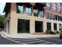 Building entrance with covered parking and sidewalk leads to condo units at 319 Atlanta Se St # 317, Marietta, GA 30060