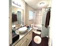 Well-lit bathroom with a modern vanity, sleek fixtures, and a shower-tub combination perfect for relaxation at 579 Wexwood Dr, Riverdale, GA 30274