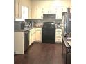 Functional kitchen with stainless steel appliances, sleek countertops, and ample cabinet space for all your culinary needs at 579 Wexwood Dr, Riverdale, GA 30274