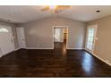 Large living room with ceiling fan, and hardwood flooring at 945 Navajo Trl, Covington, GA 30016