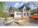 The exterior features an attached garage, white siding and black window trim at 1430 Oconee Ne Pass, Brookhaven, GA 30319