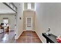 Welcoming entryway with hardwood floors, high ceilings, and natural light at 7130 Rocking Horse Ln, Cumming, GA 30040