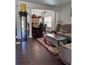 Elegant living room showcasing hardwood floors, formal dining area, decorative columns, and stylish furnishings at 1668 Scenic Pines Dr, Lawrenceville, GA 30044