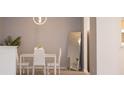Cozy dining area features modern chandelier and neutral gray paint at 4203 Fairington Village Dr, Lithonia, GA 30038