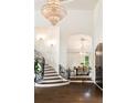 Open entryway with a chandelier, staircase, and view of the dining room at 3511 Roxboro Ne Rd, Atlanta, GA 30326