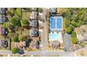 Aerial view showcasing the property's location near community amenities like a pool and tennis courts at 4215 Evans Farms Dr, Cumming, GA 30040