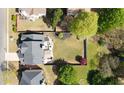 Aerial view displaying a fenced backyard with a patio and landscaping, enhancing the property's privacy at 4215 Evans Farms Dr, Cumming, GA 30040