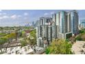 Expansive city view showcasing nearby high-rise condos and towering buildings against a clear sky at 1130 Piedmont Ne Ave # 1407, Atlanta, GA 30309