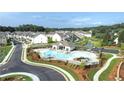 Community pool with lounge seating and manicured landscaping, perfect for relaxing and enjoying the outdoors at 4143 Halton Rd, Duluth, GA 30097