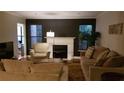 Inviting living area with a fireplace, hardwood floors, and contemporary decor at 1804 Huntingdon Chase # 1804, Atlanta, GA 30350