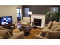 Cozy living room with fireplace, large windows, and plush seating at 1804 Huntingdon Chase # 1804, Atlanta, GA 30350