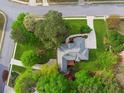 Overhead shot of the property showcasing landscaped yard, surrounding trees, driveway, and neighborhood streets at 2060 Pate Ridge Dr, Loganville, GA 30052