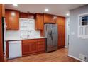 Bright kitchen featuring wooden cabinets, stainless steel refrigerator, and appliances, alongside white countertops at 2744 Hunting Hill Ln, Decatur, GA 30033