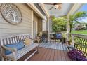 Inviting front porch with seating, decor, and a view of the well manicured front yard at 5533 Woodridge Ln, Douglasville, GA 30135