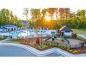 Relax by the community pool, featuring a playground and gazebo area at 1119 Blue Juniper Circle, Loganville, GA 30052