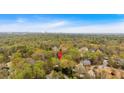 Panoramic aerial view showcasing the property's location surrounded by verdant trees and other residential areas at 115 Mount Paran Rdg, Atlanta, GA 30327