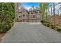 Beautiful brick home with multiple garage spaces and long driveway at 115 Mount Paran Rdg, Atlanta, GA 30327
