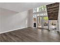 Bright living room with hardwood floors and double doors leading to a patio at 41 Cantey Nw Pl, Atlanta, GA 30327