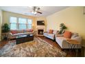 Cozy living room features a fireplace and plush seating at 5556 Cascade Sw Run, Atlanta, GA 30336