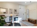 Inviting living room with a fireplace, built-in shelving, and stylish decor at 70 Sheridan Ne Dr # 10, Atlanta, GA 30305