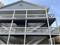 Building exterior featuring multiple levels of outdoor patios with white railings at 3518 Shepherds Path, Decatur, GA 30034