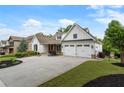 Attractive home with a well-manicured lawn, colorful flowerbeds, and a spacious driveway leading to the two-car garage at 1127 Bank Se St, Smyrna, GA 30080