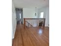 Bright hallway with hardwood floors and access to several rooms in the home at 4149 Silver Hill Ct, Snellville, GA 30039