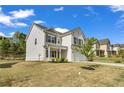 Well maintained two-story home with attached two car garage, nice landscaping and manicured lawn at 5140 Woodline View Cir, Auburn, GA 30011