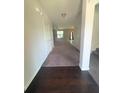 Inviting entryway with hardwood floors transitioning to plush carpeting, creating a warm welcome at 5243 Cantbury Way, Atlanta, GA 30349