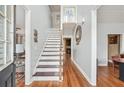 Inviting foyer with hardwood floors and staircase leading to the upper level at 642 Towering Pine Trl, Lawrenceville, GA 30045