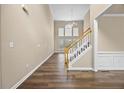 Bright entryway with hardwood floors, a staircase, and large windows providing natural light at 902 Brumley Nw Ln, Kennesaw, GA 30152