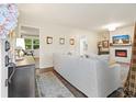 Bright living room with an open floor plan, fireplace, and stylish decor at 2449 Fraser Rd, Marietta, GA 30066
