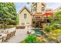Backyard oasis featuring a patio, spa, built in bar, and outdoor seating area at 3915 Merriweather Woods, Johns Creek, GA 30022