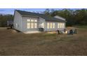 A cozy backyard featuring an outdoor seating area with a fire pit for relaxing evenings at 4470 Madison Hall Dr, Cumming, GA 30028