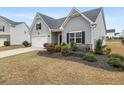 Charming home with manicured lawn, mature landscaping and attached garage at 4470 Madison Hall Dr, Cumming, GA 30028