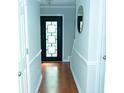 Welcoming entryway with a dark front door featuring decorative glass and light gray walls at 909 Otter Ne Way, Marietta, GA 30068