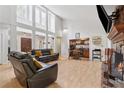 Open-concept living area with a fireplace, built-in bar, and plenty of natural light at 2470 Woodmere Dr, Marietta, GA 30068