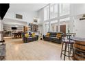 Bright living room with high ceilings, large windows, hardwood floors, and comfortable seating at 2470 Woodmere Dr, Marietta, GA 30068