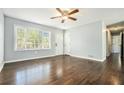Bright living room features hardwood floors, neutral paint, and plenty of natural light at 2804 Carolyn Se Dr, Smyrna, GA 30080