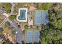 Aerial view of community amenities including pool, tennis courts, parking and playground at 818 Prada Ct, Lawrenceville, GA 30043