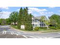 View of a residential neighborhood with two-story homes and lush greenery at 121 Dunleith Sw Pkwy, Marietta, GA 30008