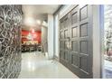 Stunning foyer with textured wall, double doors, and a glimpse of the dining area beyond at 3011 Cravey Trl, Tucker, GA 30345