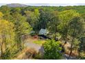 Secluded two-story home nestled within a lush, green forest, offering privacy and tranquility at 1800 East Gate Dr, Smoke Rise, GA 30087