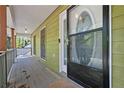 Inviting front porch with a decorative storm door and wood plank flooring at 4819 Elam Rd, Stone Mountain, GA 30083