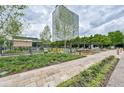 Community courtyard featuring stone walkways, lush landscaping, and an outdoor lounge area at 10 Perimeter Summit Ne Blvd # 2110, Brookhaven, GA 30319