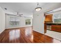 Open concept living room with hardwood floors and stainless steel appliances in kitchen area at 10 Perimeter Summit Ne Blvd # 2110, Brookhaven, GA 30319
