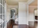 Inviting entryway with hardwood floors and an open staircase to the second floor at 2045 Villa Spring Ct, Dacula, GA 30019