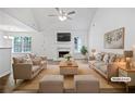 Bright living room featuring neutral paint, a fireplace, and large windows for natural light at 100 Chartres St, Dallas, GA 30157